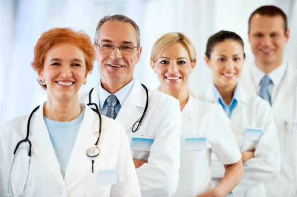 Smiling successful team of doctors.
